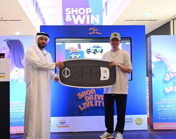 A winner, Jason Reyes, receives a symbolic key to his new Nissan X-Trail SUV. Image: DSMG