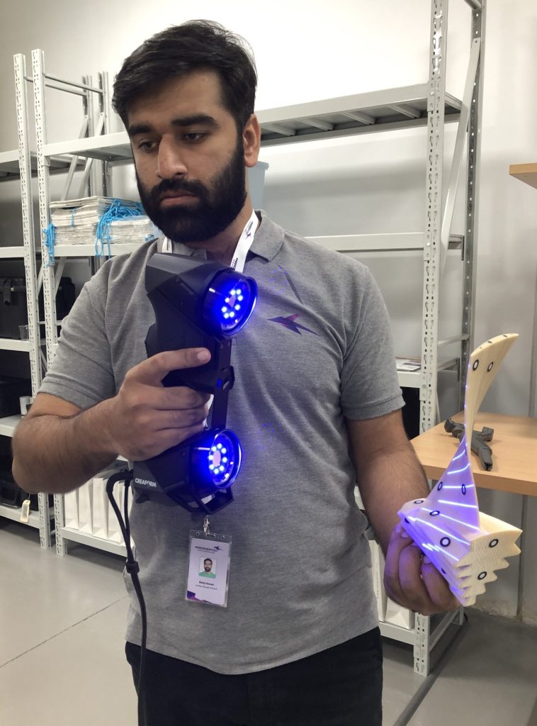 A Paradigm 3D technician scans an object for 3D printing purpose. Image: Arnold Pinto